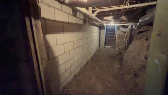 Hydraulic jacks actively lifting a residential foundation back to its original position during a JLB repair project